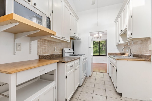 3 Stebbins Close Close Unit 3, Ridgefield, CT 06877 - kitchen with white appliances, light tile patterned flooring, a chandelier, tasteful backsplash, and white cabinetry