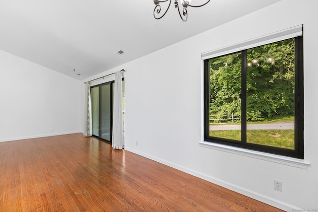 3 Stebbins Close Close Unit 3, Ridgefield, CT 06877 - unfurnished room with a chandelier, wood finished floors, and vaulted ceiling