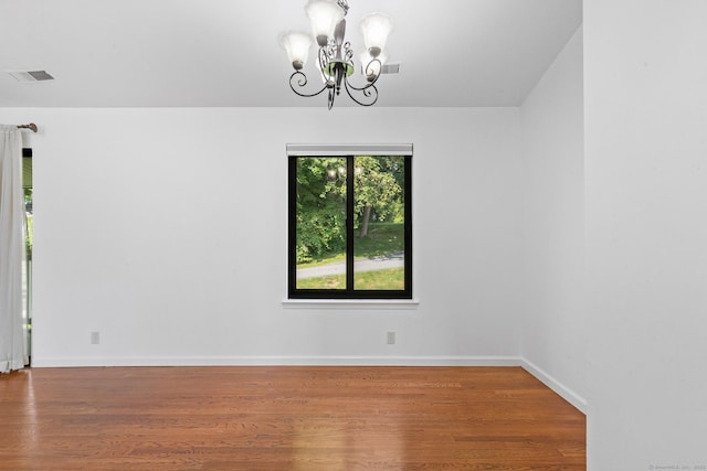 3 Stebbins Close Close Unit 3, Ridgefield, CT 06877 - unfurnished room with a chandelier and wood finished floors