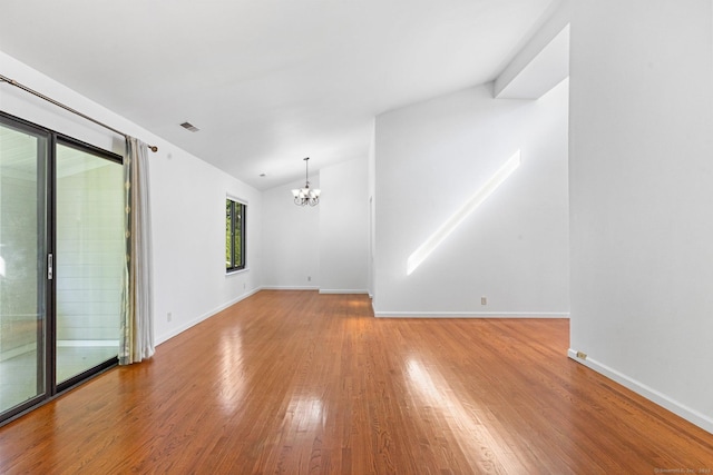 3 Stebbins Close Close Unit 3, Ridgefield, CT 06877 - empty room with a chandelier, wood finished floors, and vaulted ceiling