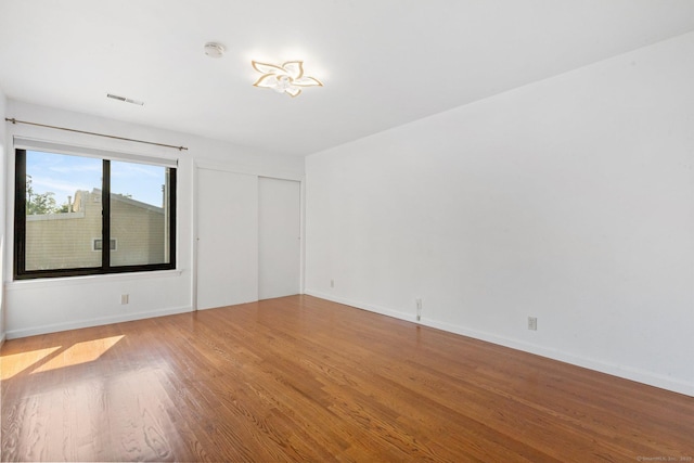 3 Stebbins Close Close Unit 3, Ridgefield, CT 06877 - empty room with wood finished floors and a smoke detector