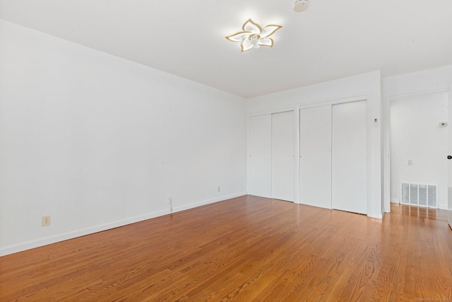 3 Stebbins Close Close Unit 3, Ridgefield, CT 06877 - unfurnished bedroom with two closets and wood finished floors