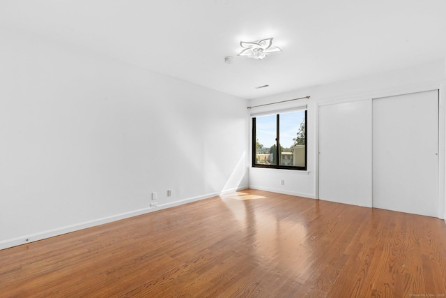 3 Stebbins Close Close Unit 3, Ridgefield, CT 06877 - unfurnished bedroom featuring wood finished floors and a closet
