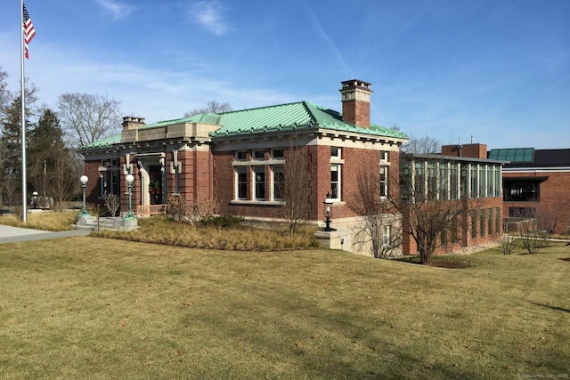 3 Stebbins Close Close Unit 3, Ridgefield, CT 06877 - view of property exterior with a chimney, a yard, brick siding, and a metal roof