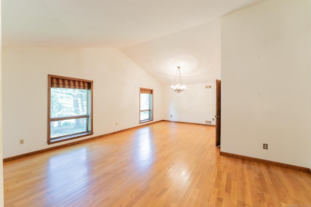 54 Timber Ln, Avon, CT 06001 - empty room featuring a chandelier, lofted ceiling, and light wood-type flooring