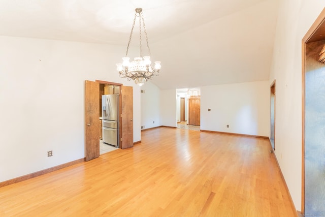 54 Timber Ln, Avon, CT 06001 - unfurnished room featuring a chandelier, light wood-style flooring, and vaulted ceiling
