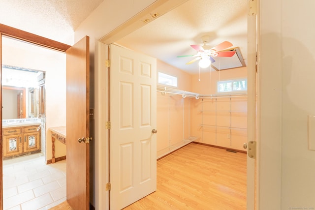 54 Timber Ln, Avon, CT 06001 - walk in closet with ceiling fan and light wood-style floors