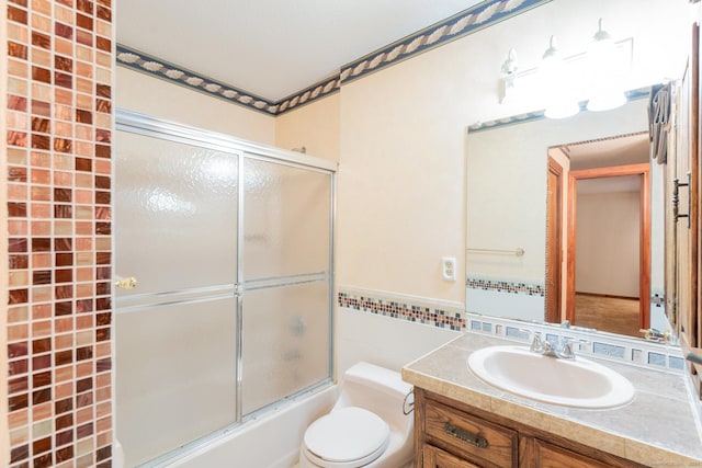 54 Timber Ln, Avon, CT 06001 - bathroom featuring vanity, tile walls, enclosed tub / shower combo, and a wainscoted wall