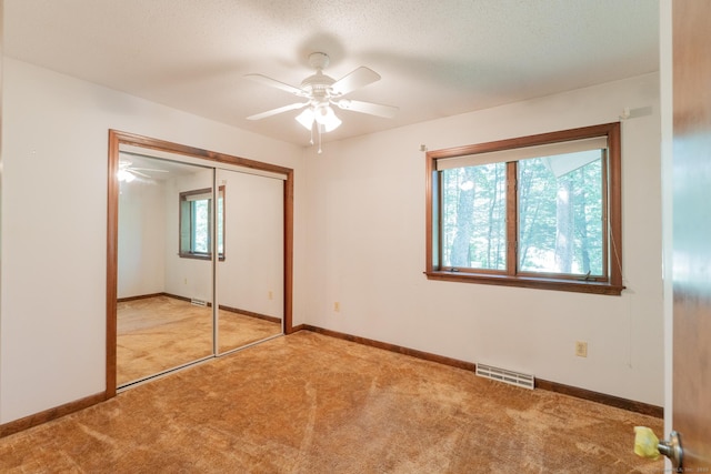 54 Timber Ln, Avon, CT 06001 - unfurnished bedroom featuring carpet flooring, a closet, and ceiling fan