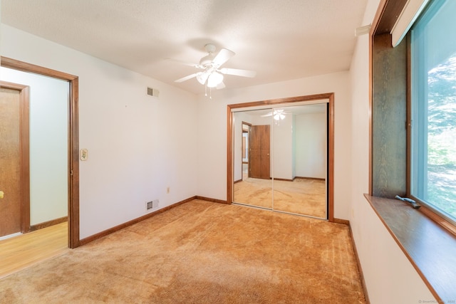54 Timber Ln, Avon, CT 06001 - unfurnished bedroom with light carpet, a closet, and a ceiling fan