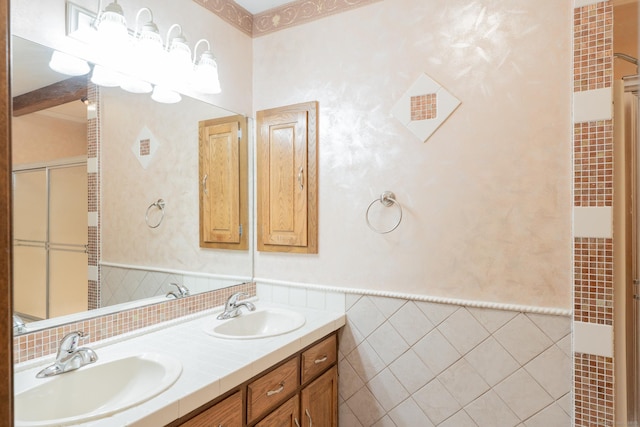 54 Timber Ln, Avon, CT 06001 - bathroom featuring tile walls, double vanity, a wainscoted wall, a heating unit, and a shower