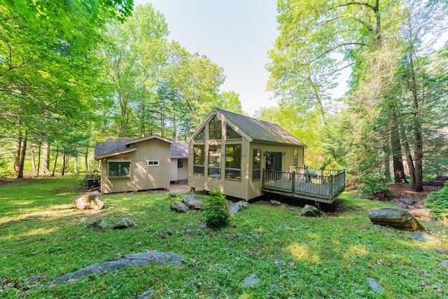 54 Timber Ln, Avon, CT 06001 - rear view of property with a deck, a lawn, an outdoor structure, and a sunroom