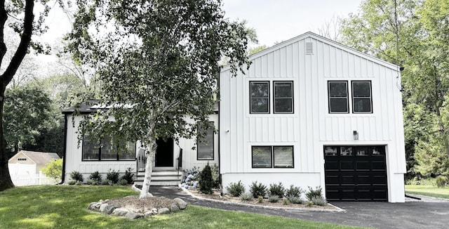 27 Mary Ln, Greenwich, CT 06878 - modern inspired farmhouse with board and batten siding, an attached garage, a front yard, and driveway
