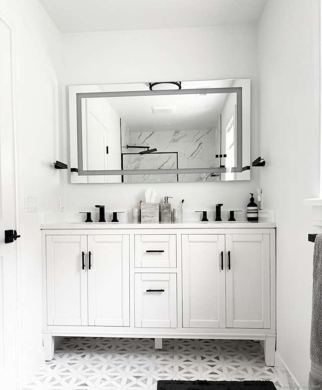 27 Mary Ln, Greenwich, CT 06878 - bathroom with double vanity, a marble finish shower, and tile patterned floors