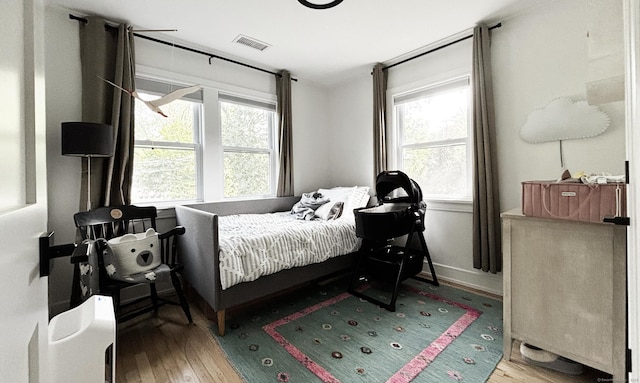 27 Mary Ln, Greenwich, CT 06878 - bedroom featuring wood-type flooring and multiple windows