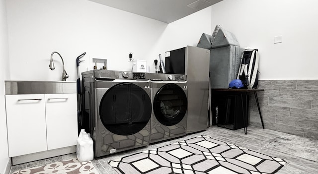 27 Mary Ln, Greenwich, CT 06878 - laundry area with separate washer and dryer, tile walls, and wainscoting