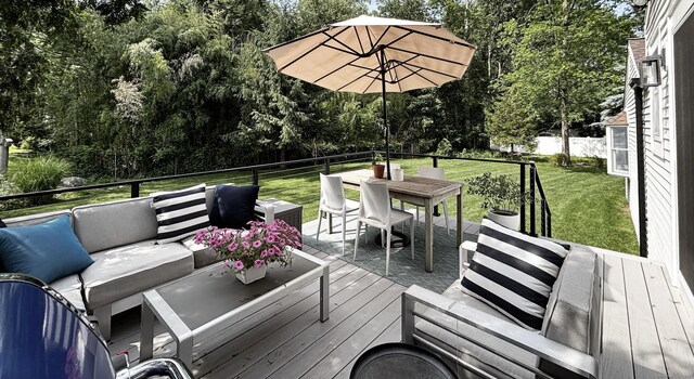 27 Mary Ln, Greenwich, CT 06878 - wooden deck with an outdoor living space, outdoor dining space, and view of scattered trees