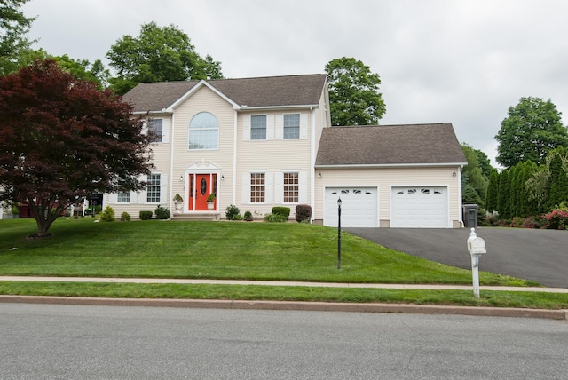 6 Fawn Meadow Dr, Naugatuck, CT 06770 - colonial home with an attached garage, asphalt driveway, a front lawn, and roof with shingles