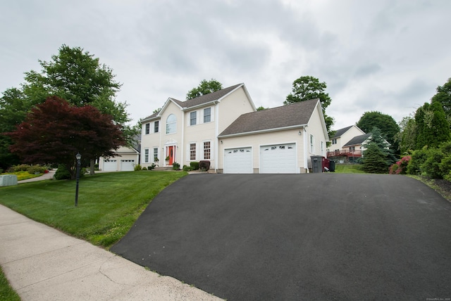 6 Fawn Meadow Dr, Naugatuck, CT 06770 - colonial home featuring an attached garage, a front lawn, and driveway
