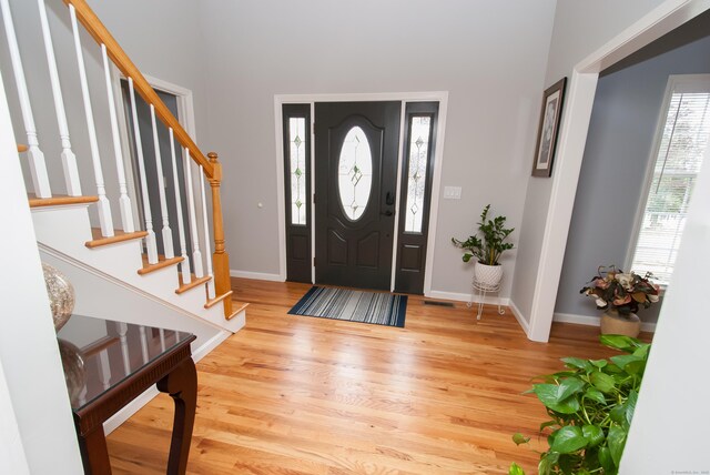 6 Fawn Meadow Dr, Naugatuck, CT 06770 - entryway with light wood-style floors and stairway