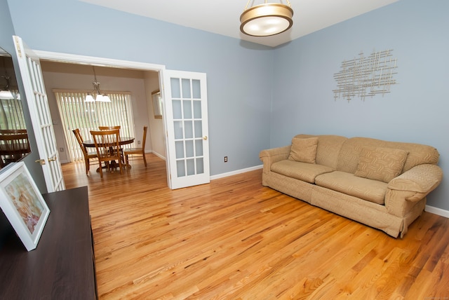 6 Fawn Meadow Dr, Naugatuck, CT 06770 - living room with a chandelier, light wood-type flooring, and french doors