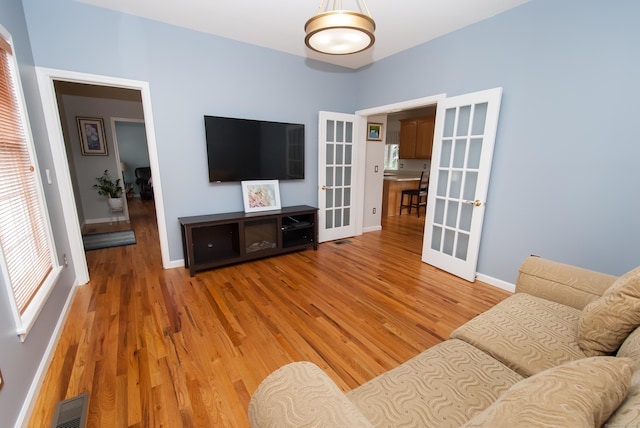 6 Fawn Meadow Dr, Naugatuck, CT 06770 - living area featuring french doors and light wood-style flooring