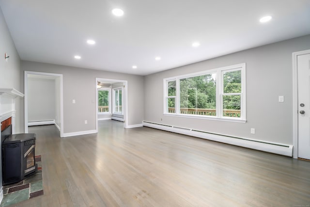 22 Lonetown Rd, Redding, CT 06896 - unfurnished living room with baseboard heating, wood finished floors, healthy amount of natural light, and recessed lighting