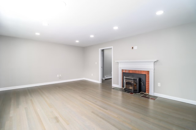 22 Lonetown Rd, Redding, CT 06896 - unfurnished living room with recessed lighting, wood finished floors, and a baseboard heating unit