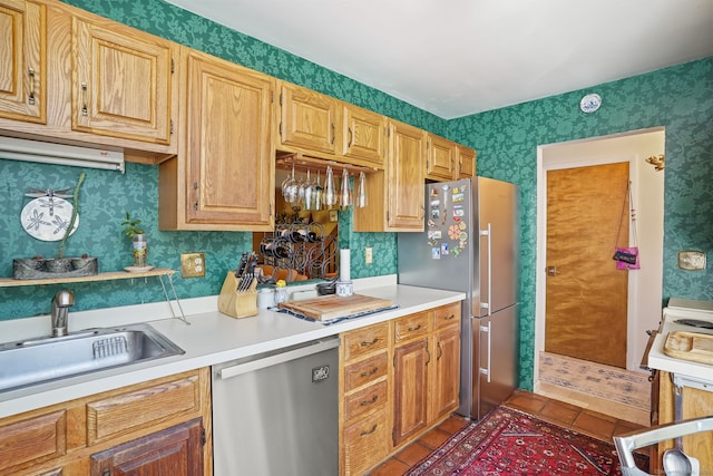 123 Old Belden Hill Rd Apt 24, Norwalk, CT 06850 - kitchen featuring stainless steel appliances, wallpapered walls, light countertops, and tile patterned flooring