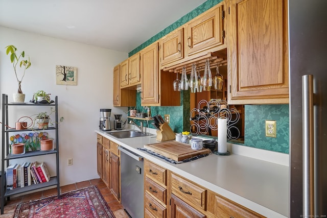 123 Old Belden Hill Rd Apt 24, Norwalk, CT 06850 - kitchen with stainless steel dishwasher, light countertops, and freestanding refrigerator