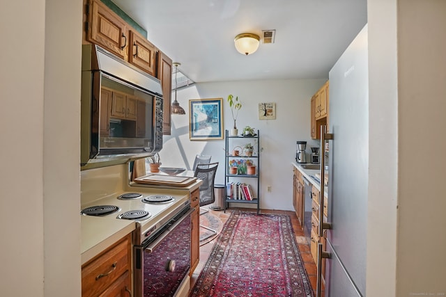 123 Old Belden Hill Rd Apt 24, Norwalk, CT 06850 - kitchen with stainless steel microwave, white electric stove, light countertops, and brown cabinets