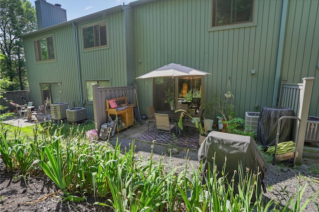 123 Old Belden Hill Rd Apt 24, Norwalk, CT 06850 - rear view of property featuring a chimney and a patio