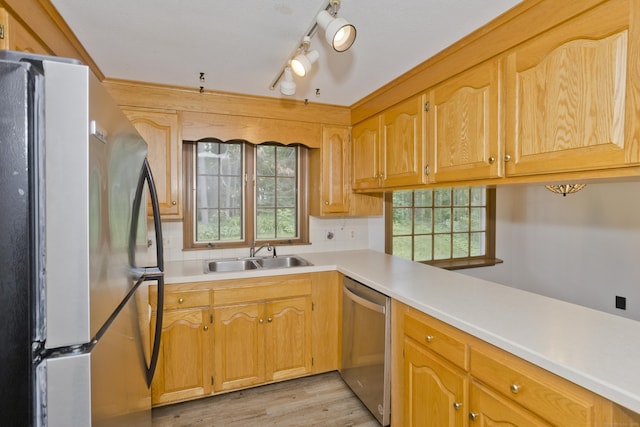 417 Billings Rd, Somers, CT 06071 - kitchen featuring appliances with stainless steel finishes, healthy amount of natural light, light wood finished floors, and tasteful backsplash