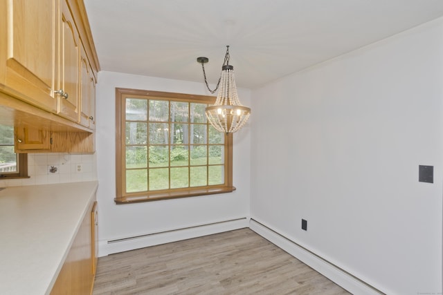 417 Billings Rd, Somers, CT 06071 - unfurnished dining area featuring a chandelier, baseboard heating, a baseboard heating unit, and light wood finished floors