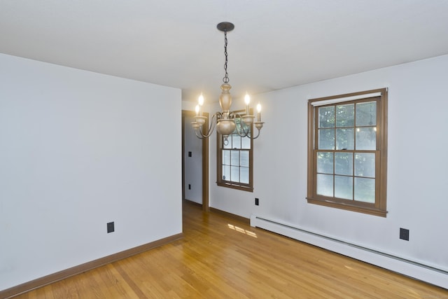 417 Billings Rd, Somers, CT 06071 - spare room featuring baseboard heating, a chandelier, light wood-style floors, and plenty of natural light