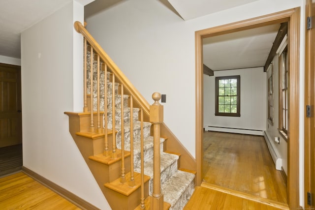 417 Billings Rd, Somers, CT 06071 - stairs featuring a baseboard heating unit, wood finished floors, and baseboard heating