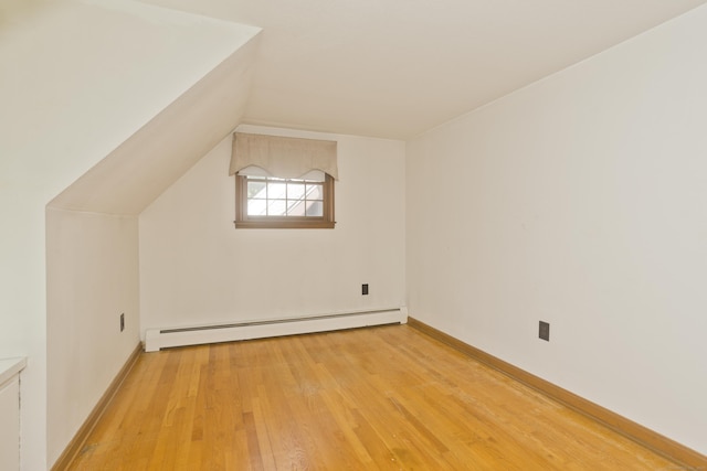 417 Billings Rd, Somers, CT 06071 - additional living space featuring a baseboard heating unit, light wood finished floors, and lofted ceiling