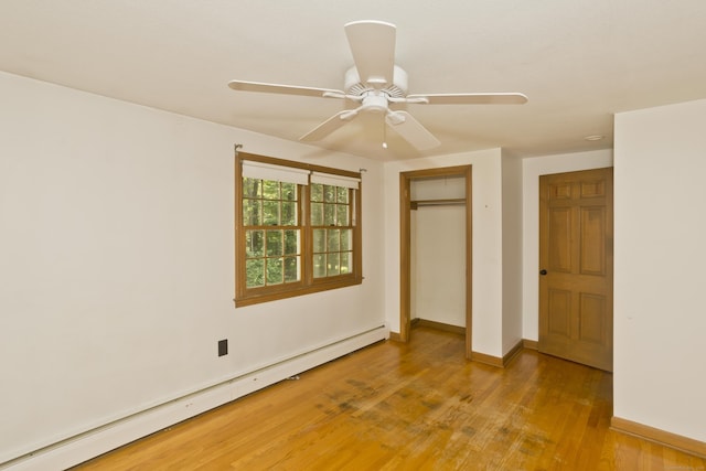417 Billings Rd, Somers, CT 06071 - unfurnished bedroom with a baseboard radiator, light wood finished floors, a closet, and ceiling fan