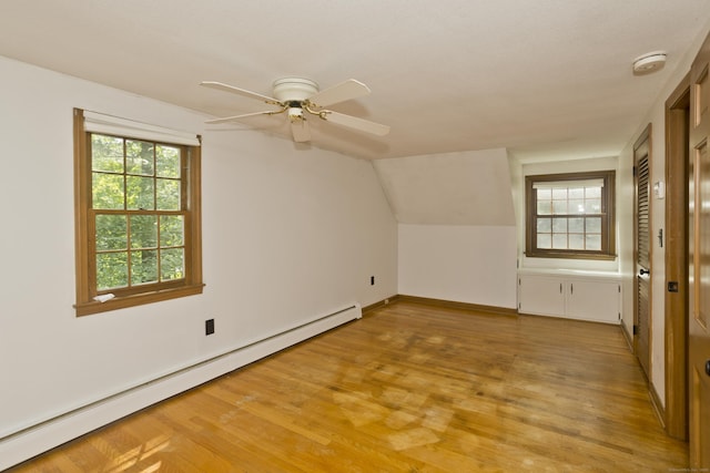 417 Billings Rd, Somers, CT 06071 - additional living space with a baseboard radiator, light wood finished floors, ceiling fan, and vaulted ceiling