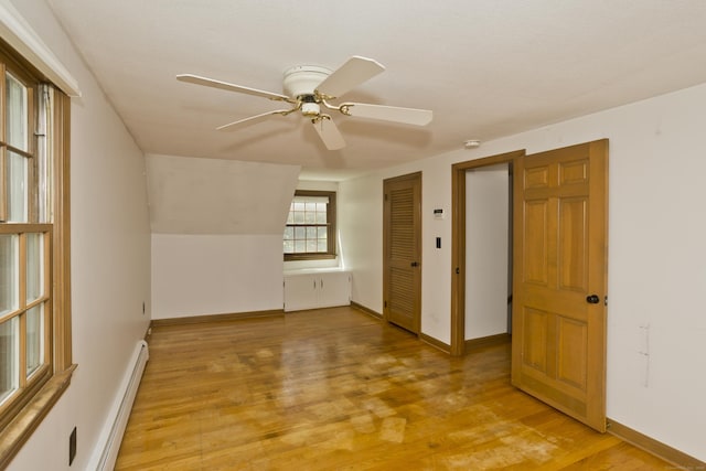 417 Billings Rd, Somers, CT 06071 - spare room featuring a baseboard radiator, ceiling fan, light wood-style floors, and a smoke detector