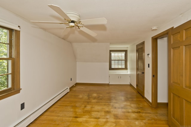 417 Billings Rd, Somers, CT 06071 - additional living space featuring baseboard heating, light wood-style floors, plenty of natural light, and a ceiling fan