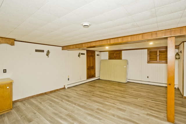 417 Billings Rd, Somers, CT 06071 - finished basement featuring baseboard heating, light wood finished floors, and a baseboard radiator