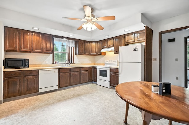 92 Yates St, West Haven, CT 06516 - kitchen with white appliances, under cabinet range hood, light countertops, recessed lighting, and ceiling fan