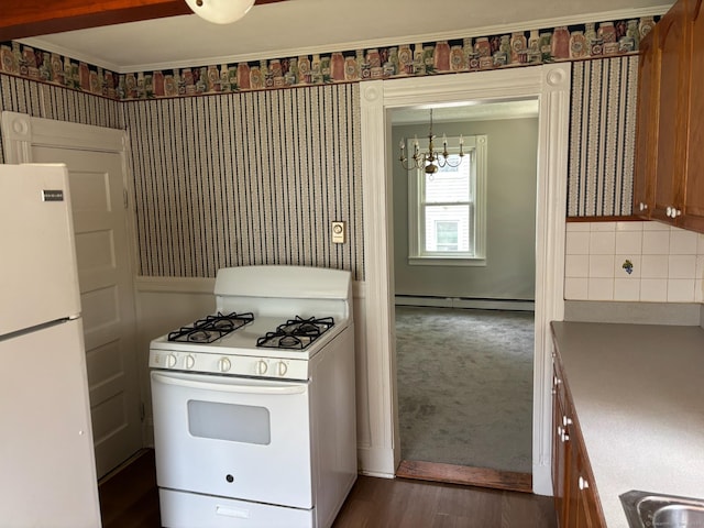 97 Capen St, Windsor, CT 06095 - kitchen featuring white appliances, a chandelier, a baseboard heating unit, wallpapered walls, and dark wood-style floors