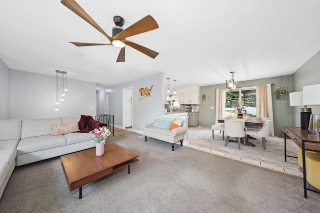 69 Sills Dr, Watertown, CT 06779 - living room with light colored carpet and ceiling fan