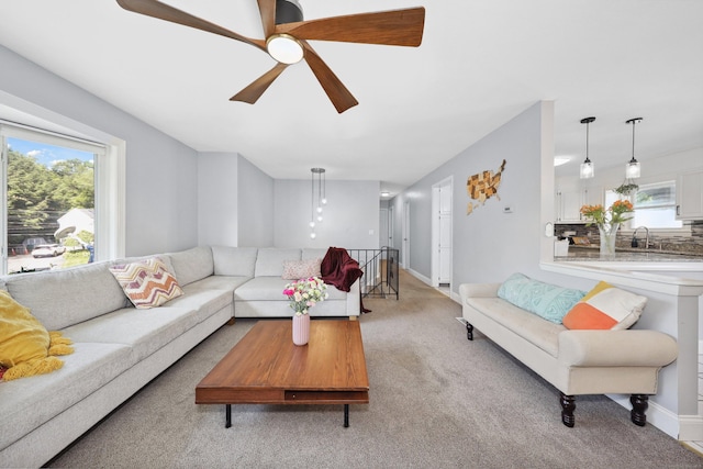 69 Sills Dr, Watertown, CT 06779 - carpeted living area featuring a sink and ceiling fan