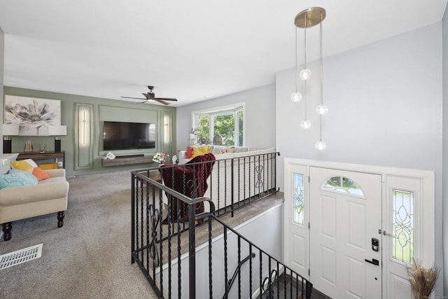 69 Sills Dr, Watertown, CT 06779 - carpeted living area with ceiling fan