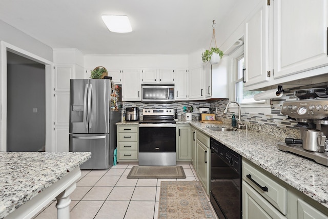 69 Sills Dr, Watertown, CT 06779 - kitchen featuring stainless steel appliances, backsplash, light stone countertops, and light tile patterned flooring