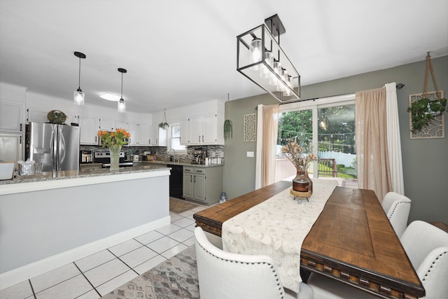 69 Sills Dr, Watertown, CT 06779 - dining area featuring light tile patterned floors