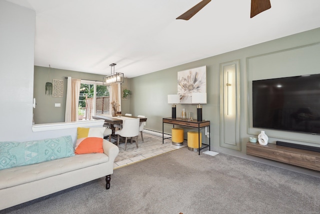 69 Sills Dr, Watertown, CT 06779 - carpeted living room with a baseboard radiator and ceiling fan